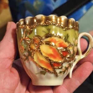 Elegant Gold and Orange Floral Ceramic Teacup